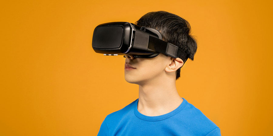 a man wearing blue t-shirt and a black VR headset